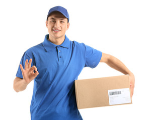 Delivery man with box showing OK on white background