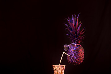 club concept ,black and gold pineapples in sunglasses