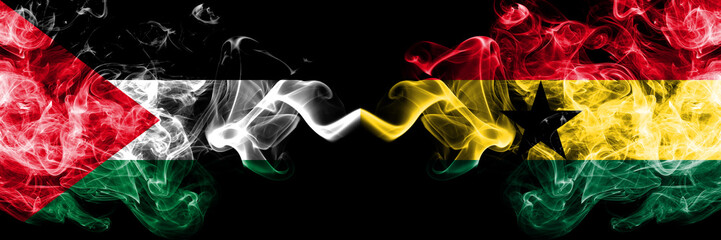 Palestine vs Ghana, Ghanaian smoky mystic flags placed side by side. Thick colored silky smokes flag of Palestinians and Ghana, Ghanaian