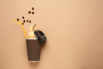 Coffee cup with tasty cotton candy on color background