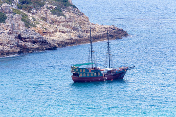 Naklejka na ściany i meble Turist ship moored near the shore