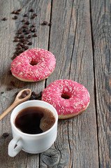 Coffee and pink donuts