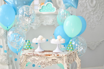 Children birthday decorations. A lot of balloons blue and green colors.