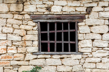 Fototapeta na wymiar Old stone house village stable barn forge Ukraine nature retro buildings countryside forged window