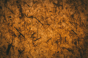 Dark brown texture and background made with recycled paper.   