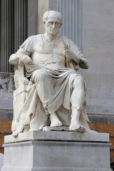 Fototapeta premium statue of a roman emperor (?) in front of the parliament in Vienna (Austria)