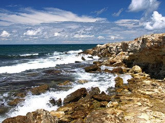 Wild and picturesque beach with stones on Crimean coast of Black sea in the area of Chersonesos cape. The peninsula of Crimea