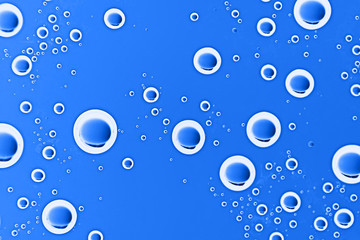 fresh drops background blue glass / wet rainy background, water drops transparent glass blue
