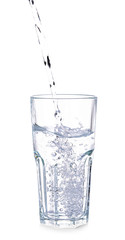 Pouring of fresh water into glass on white background