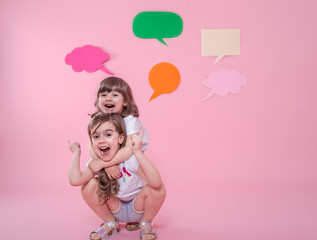 two girls on a colored background with speech icons