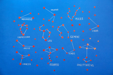 Zodiac signs constellations on color background
