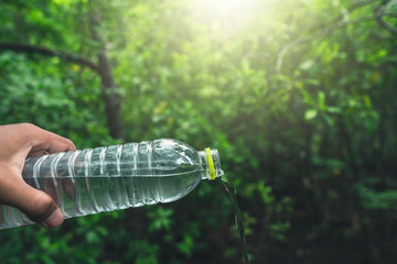 drinking water and natural green background with copy space