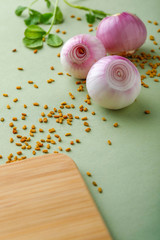 red onions on wooden board