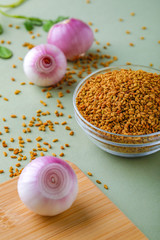 composition of red onions and spices on table