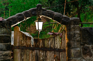 rustic door with a lantern. light behind the door
