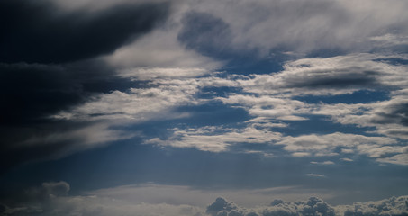 Dark blue sky with clouds. Nature background.