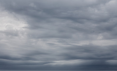 Sky background with dramatic dark clouds. Sky texture photo with storm clouds