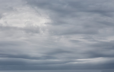 Sky background with dramatic dark clouds. Sky texture photo with storm clouds