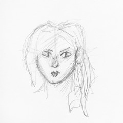 head of girl with round face and disheveled hair