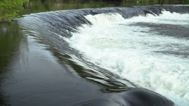 River waterfall forming a natural arc. Natural scene