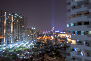 Blurred background of city views, high-rise buildings (condominiums, department stores, houses) showing the distribution of the population in the capital. 