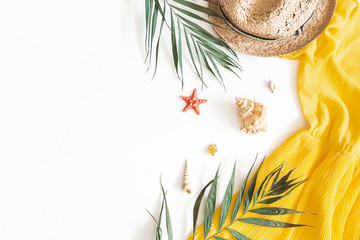 Summer composition. Tropical leaves, dress, hat on white background. Summer concept. Flat lay, top...