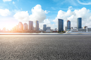 Fototapeta premium Empty highway and modern city skyline in Shanghai