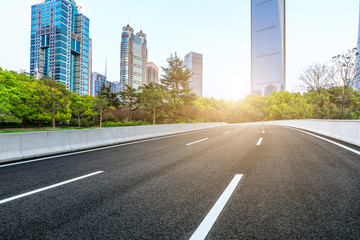 Obraz premium Shanghai modern commercial office buildings and empty asphalt highway