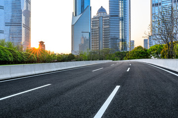 Shanghai modern commercial office buildings and empty asphalt highway