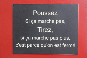 Fototapeta premium french saying of a store owner (Paris, France)