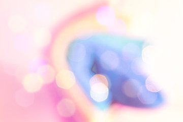 Abstract colorful blurred background with sparkling light bokeh. Unicorn silhouette. Creative art backdrop