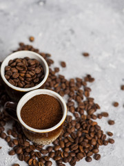 Coffee Cup with freshly ground coffee and natural coffee beans