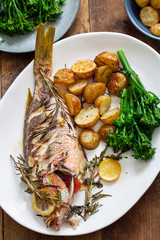 Roast red snapper with rosemary potatoes