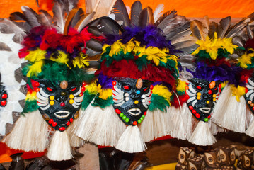 Mask .Souvenirs in the Amazon rainforest made from local nuts and animals near Iquitos. Market for...
