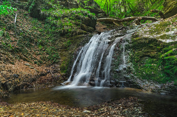 Obraz premium Beautiful waterfall deep in the forest.
