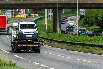 tilt trailer truck on uk motorway in fast motion