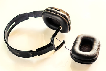 broken headphone, detachable headphones at work. concept of bad quality  listening earphones with copyspace  - image 