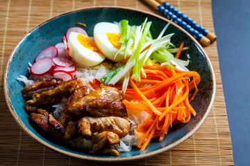 Grilled chicken thighs with rice, egg and pickled vegetables