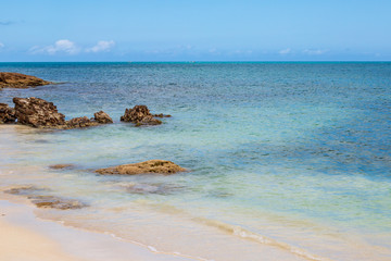 Fototapeta na wymiar Rocks on the shoreline of an Antiguan beach