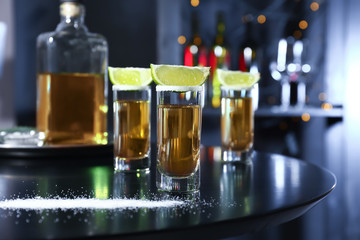Shots of tequila on table in bar