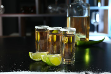 Shots of tequila on table in bar