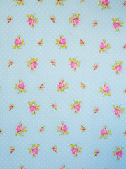 drawing of pink flowers on blue background with white dots