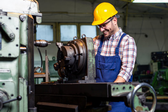 Turner Worker Is Working On A Lathe Machine In A Factory