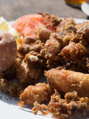 Fried chopitos, typical dish of Spanish food. Chopitos de lanzarote with crumpled potatoes