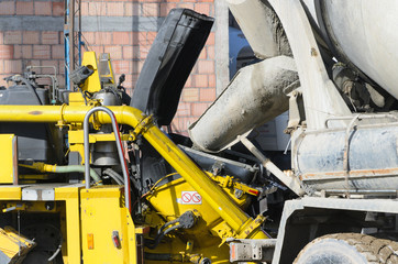 Pouring concrete to the cement pump