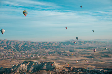 Cappadocia, Turkey November 13, 2016: Balloons with passengers in the sky early in the morning in a unique place Cappadocia