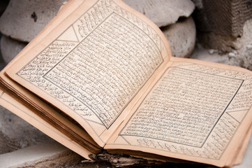 Ancient arabic manuscript with burnt pages