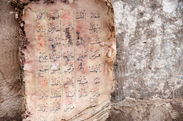 Ancient arabic manuscript with burnt pages