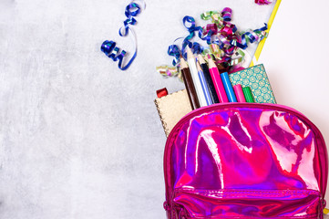 Back to school concept. Backpack with school supplies. Top view. Copy space