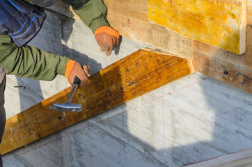 Construction worker, stairs formwork on construction site